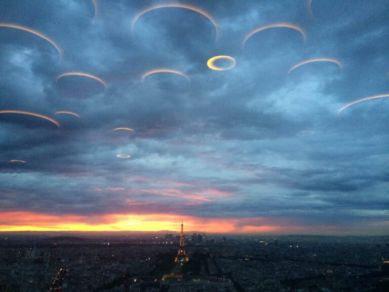 Among the clouds in the sky over the Russian River, a group of disc-shaped UFOs conceals itself